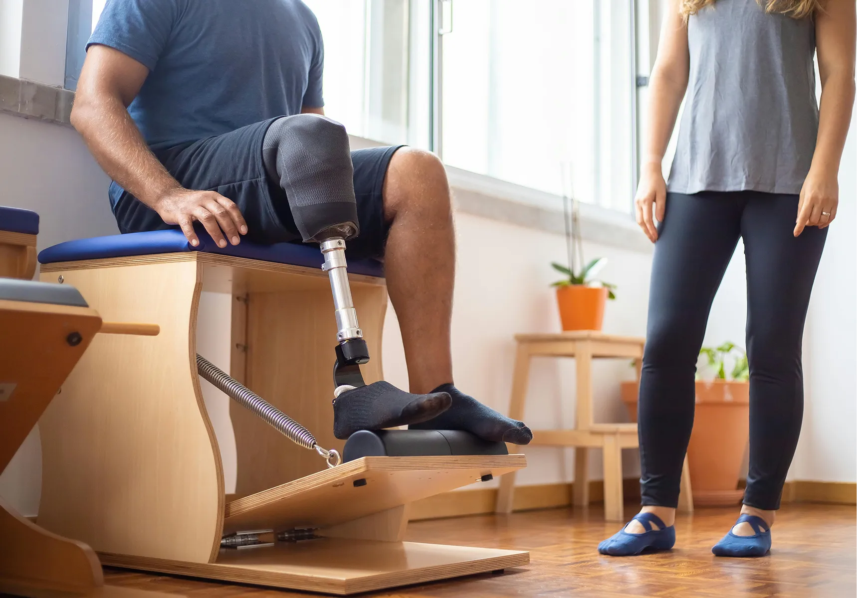 A rehabilitation session on clinical pilates equipment